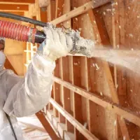 Tech spraying insulation