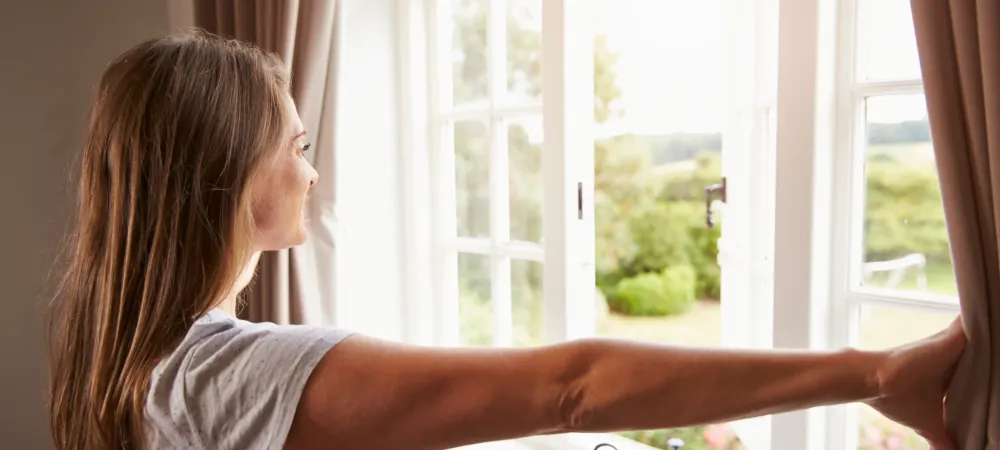 lady opening her windows