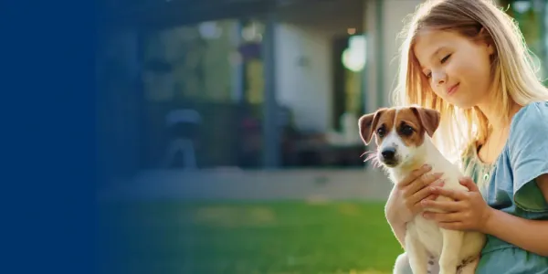 Girl playing with dog in mosquito free yard